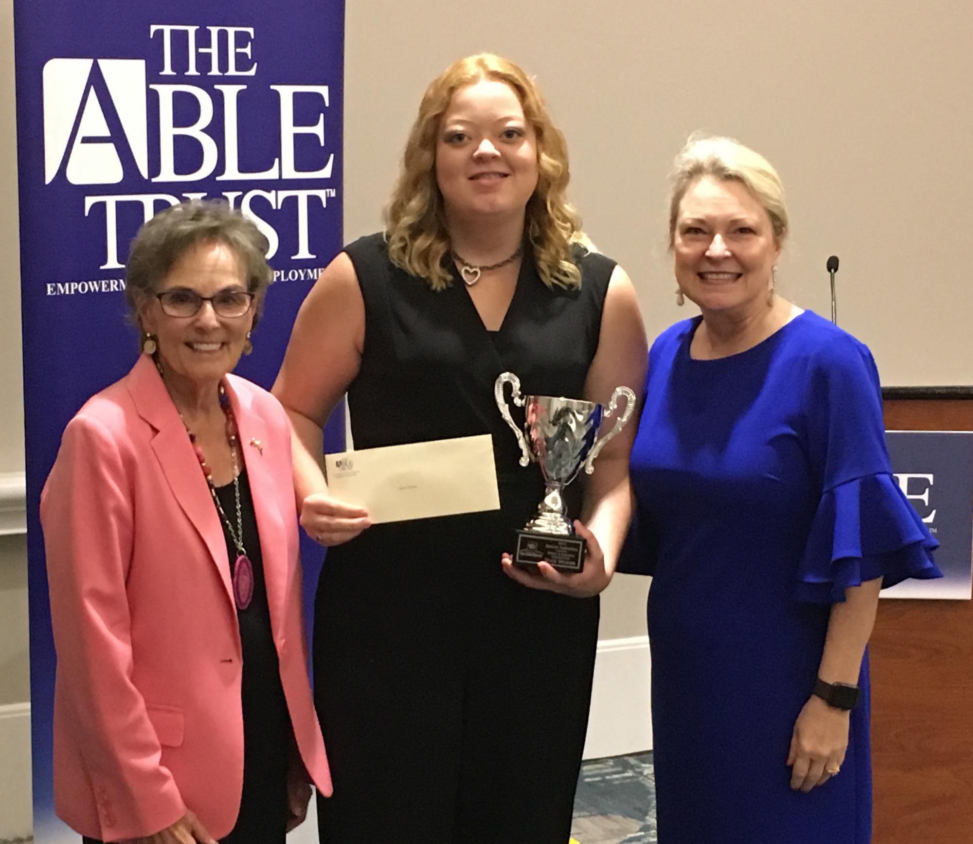 Left to right: Dr. Susanne Homant, President & CEO, The Able Trust; Audrey Thomas, 2019 State Champion, Jeannie Amendola Speech & Research Competition; and Karen Moore, Board Chair, The Able Trust.